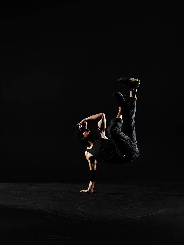 One Man Only Art Print featuring the photograph Young Male Breakdancer Balancing On One #2 by Thomas Barwick