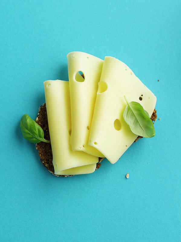 Cheese Art Print featuring the photograph Brown Bread With Cheese And Basil Leaf by Westend61
