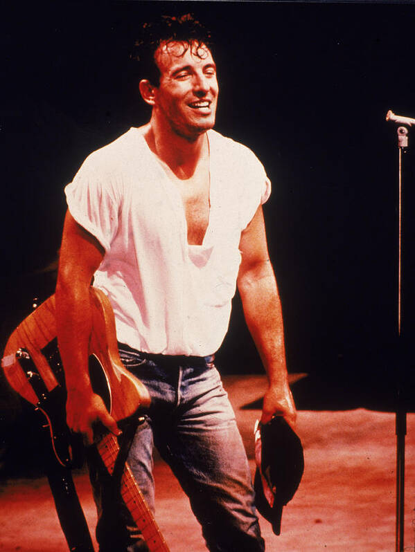 Rock Music Art Print featuring the photograph Bruce Springsteen Holds Guitar On Stage by Hulton Archive