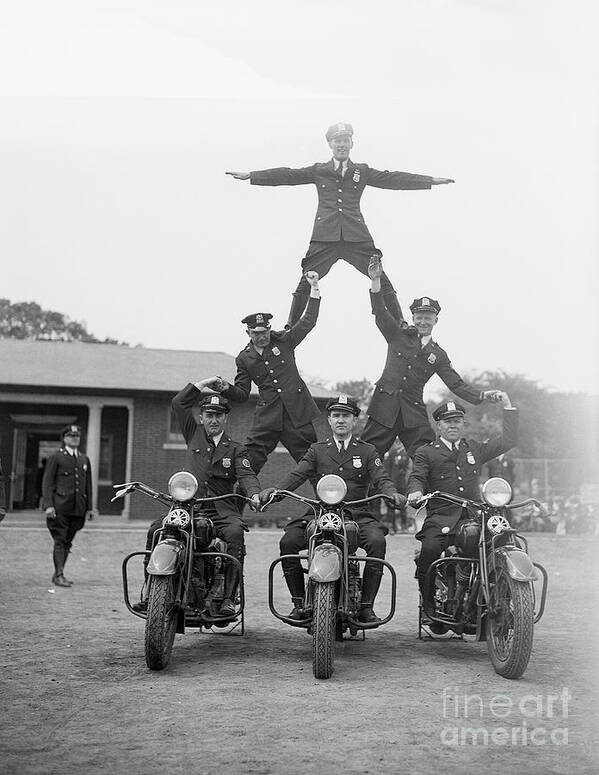 Charity Benefit Art Print featuring the photograph Motorcycle Officers Form Human Pyramid by Bettmann