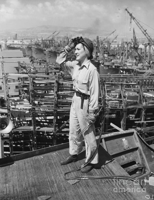 Headwear Art Print featuring the photograph Woman Working At Shipyard by Bettmann