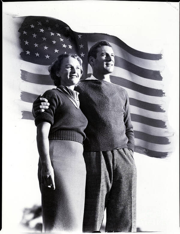 Mid Adult Women Art Print featuring the photograph Young American Couple Posing With Flag by Bettmann
