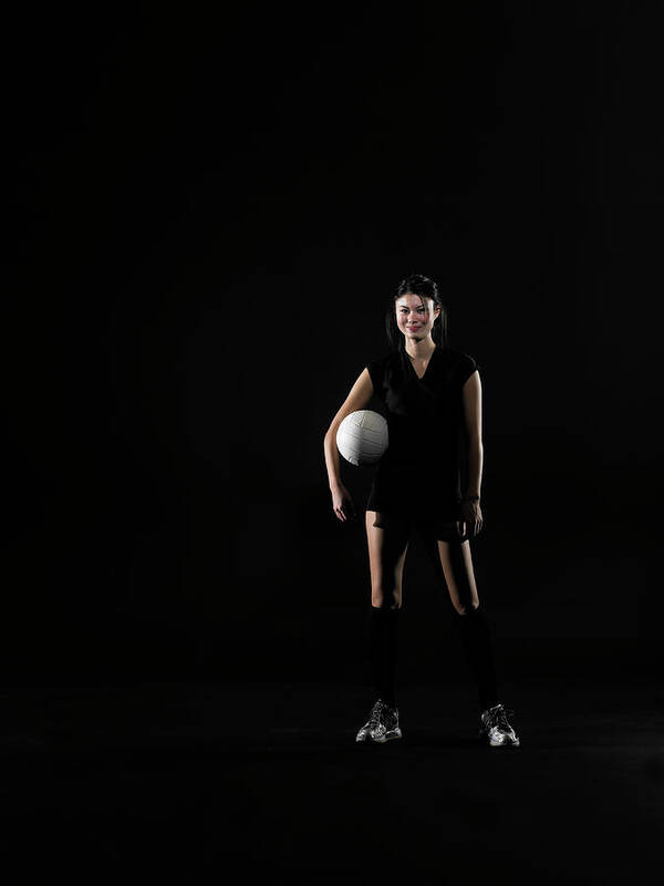 Caucasian Ethnicity Art Print featuring the photograph Young Woman Holding Volleyball, Portrait by Thomas Barwick