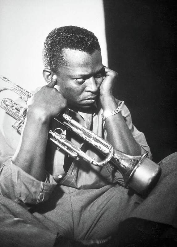 Miles Davis Art Print featuring the photograph Jazz trumpeter Miles Davis early in his career playing in New York City, circa 1955. by Album