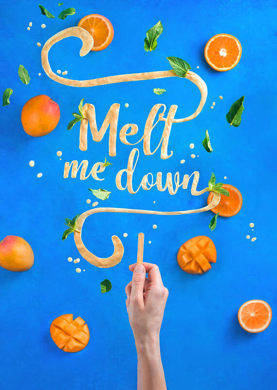 Mango Fruit Art Print featuring the photograph Mango ice cream lettering with popsicle stick spelling Melt Me Down. Creative fruit flat lay with a contrast blue background by Dina Belenko Photography
