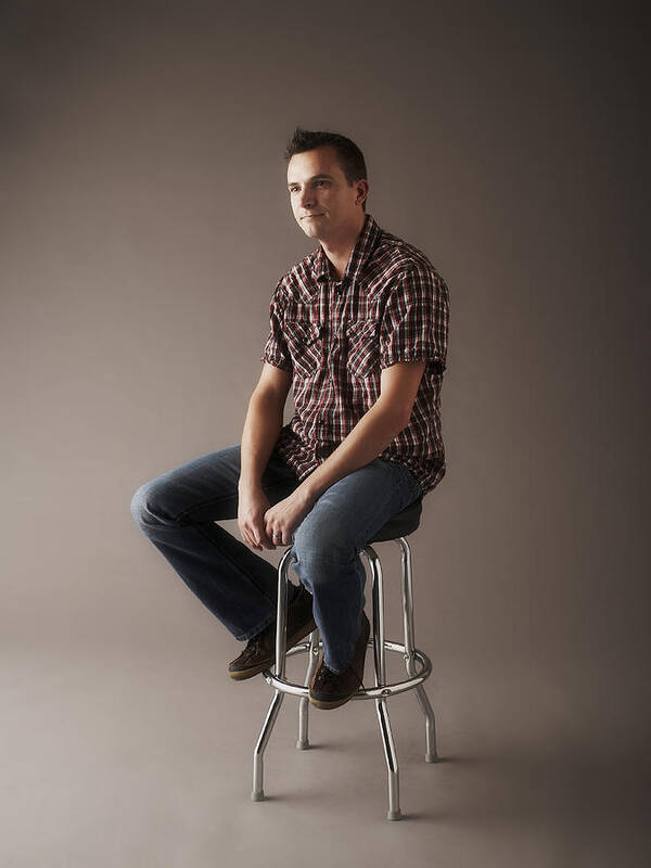 People Art Print featuring the photograph Portrait of man sitting on stool by Thomas Northcut