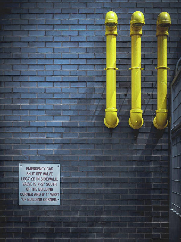 Yellow Pipes Art Print featuring the photograph yellow pipes - Queens, NY by Steve Stanger