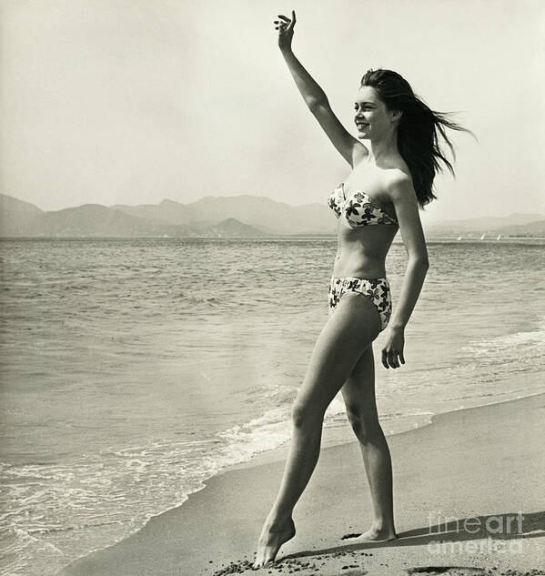 People Art Print featuring the photograph Brigitte Bardot Waving On The Beach by Bettmann