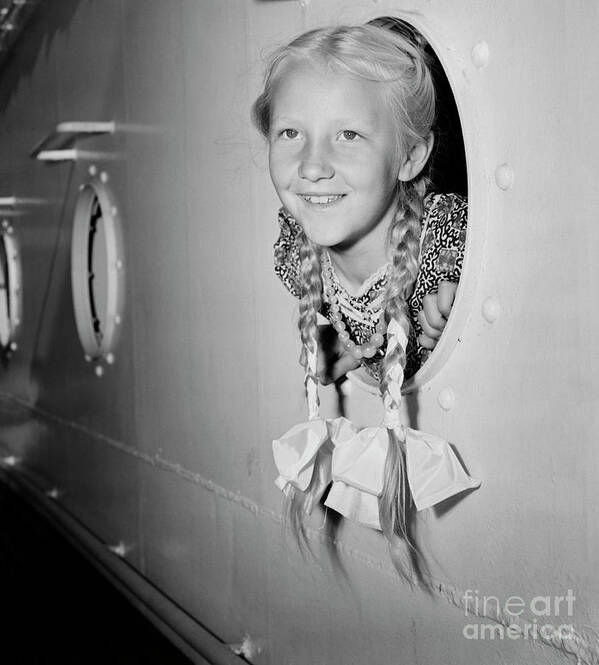 Child Art Print featuring the photograph Girl With Her Head Out Of Porthole by Bettmann