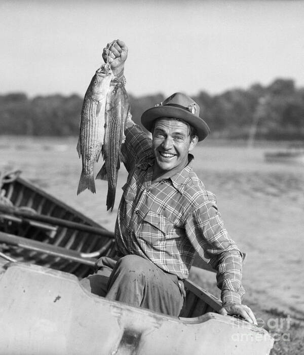 1940s Art Print featuring the photograph Man With Fresh Caught Fish by Debrocke/ClassicStock