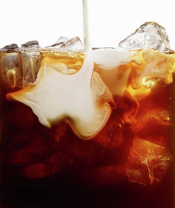 Milk Art Print featuring the photograph Close Up Of Milk Pour Into Iced Coffee by Maren Caruso