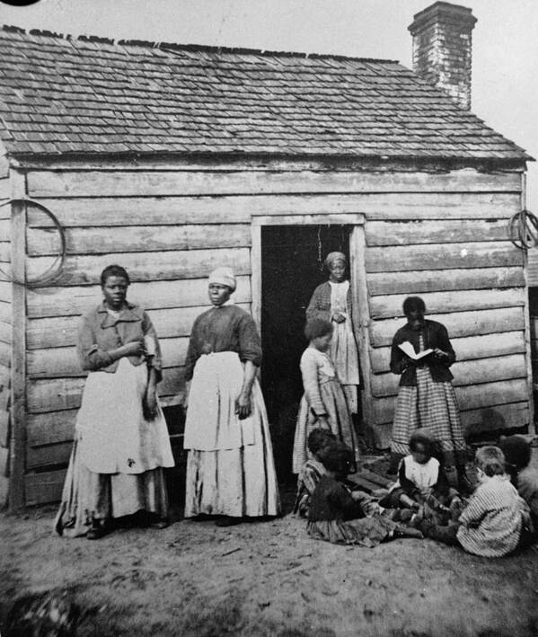 Child Art Print featuring the photograph Presumed Slaves And Their Shack by Hulton Archive