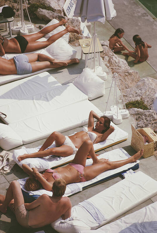 Recreational Pursuit Art Print featuring the photograph Sunbathers At Eden Roc by Slim Aarons