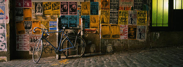 Photography Art Print featuring the photograph Bicycle Leaning Against A Wall by Panoramic Images