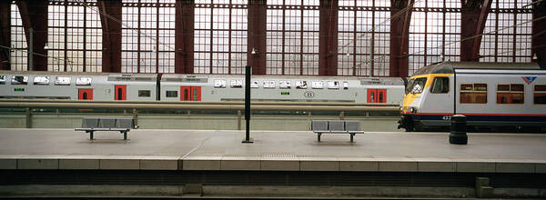 Photography Art Print featuring the photograph Trains At A Railroad Station Platform by Panoramic Images