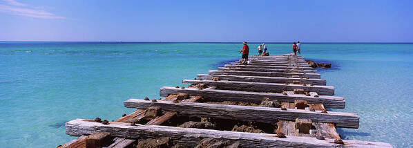 Photography Art Print featuring the photograph Tourist Walking On An Old Pier, Coquina #1 by Panoramic Images