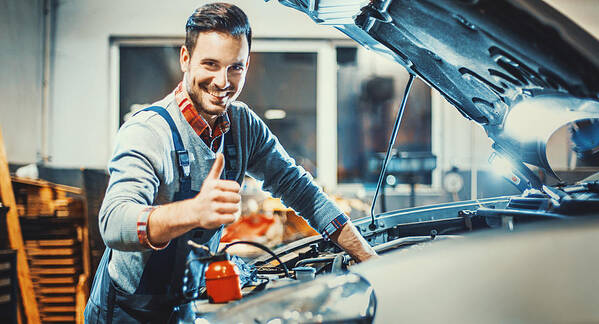 People Art Print featuring the photograph Car mechanic at work. #1 by Gilaxia