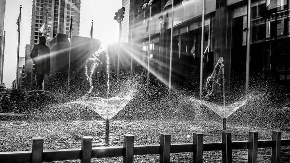 Chicago Benito Juarez Fountain Splash Spray Water Cool Sun Sunlight Warm Fine Art Black White Gray Grey Sunburst Statue Flag Flags Downtown City Cityscape Architecture Fence Iron Steel Glass Windows Reflect Glare Flare Magnificent Mile Loop Art Print featuring the photograph Plaza of the Americas by Tom Gort