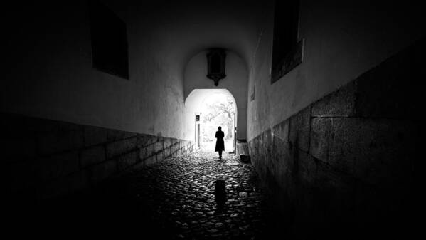 Backlight Art Print featuring the photograph The girl - Lisbon, Portugal - Black and white street photography by Giuseppe Milo
