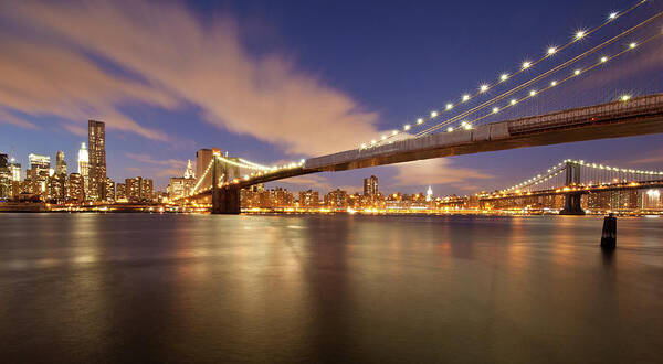 Suspension Bridge Art Print featuring the photograph Brooklyn Bridge And Manhattan At Night by J. Andruckow