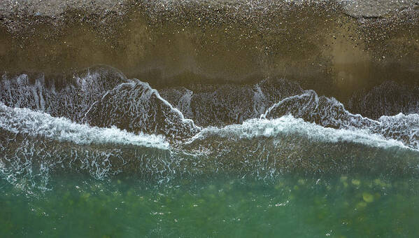 Waves Art Print featuring the photograph Aerial view ocean waves braking on a sandy beach. Nature background by Michalakis Ppalis