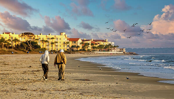 Beach Art Print featuring the photograph Old Couple Walking up Empty Beach by Darryl Brooks