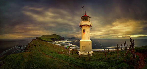 Photography Art Print featuring the photograph Mykinesholmur Lighthouse And Mykines by Panoramic Images