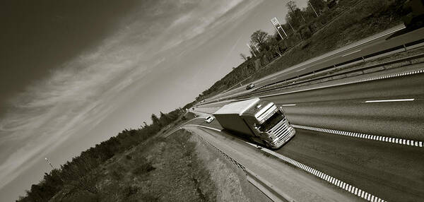 Truck Art Print featuring the photograph Trucking On Dark Highway by Christian Lagereek