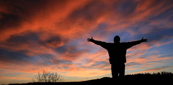 Scenics Art Print featuring the photograph Unrecognizable Man With Arms Outstretched in Worship by ImagineGolf