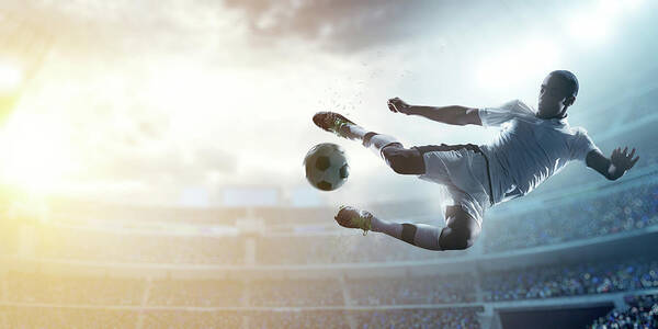 Soccer Uniform Art Print featuring the photograph Soccer Player Kicking Ball In Stadium #9 by Dmytro Aksonov