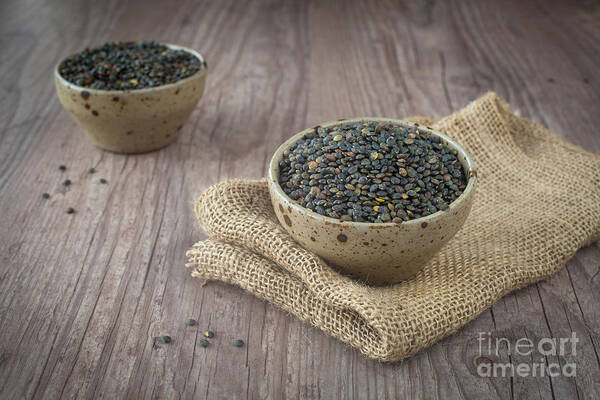 Background Art Print featuring the photograph Black lentils #1 by Sabino Parente