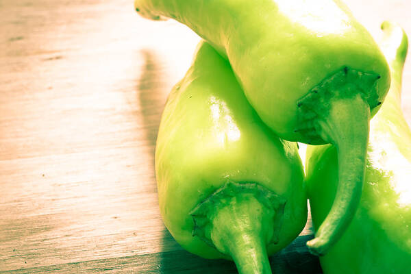 Board Art Print featuring the photograph Green jalapeno peppers #1 by Tom Gowanlock