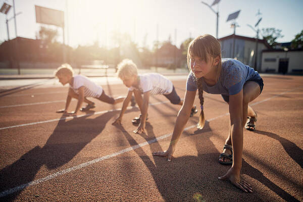 Toughness Art Print featuring the photograph Kids preparing for track run race #1 by Imgorthand