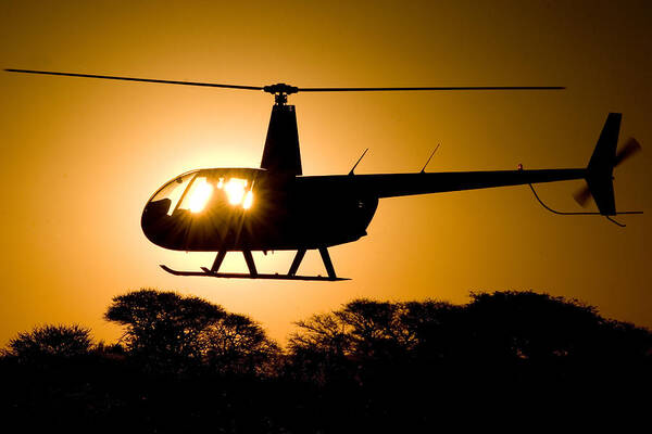 Helicopter Art Print featuring the photograph R44 Sunset #1 by Paul Job