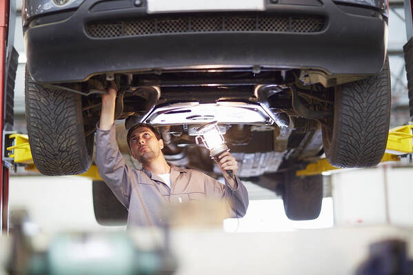 Expertise Art Print featuring the photograph Car mechanic at work in repair garage #3 by Westend61