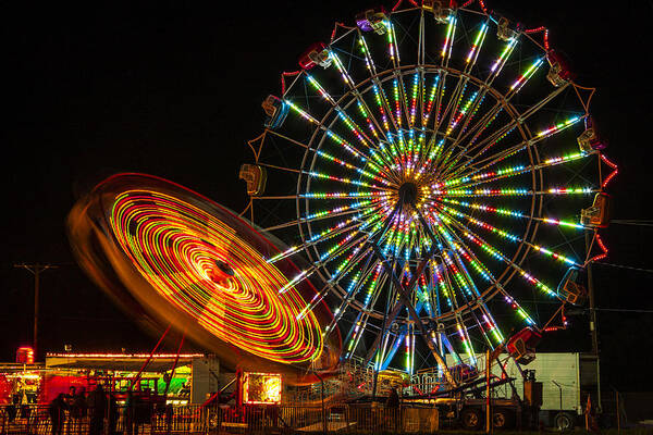 Colorful Carnival Ferris Wheel Ride At Night Prints Art Print featuring the photograph Colorful Carnival Ferris Wheel Ride at Night by Jerry Cowart