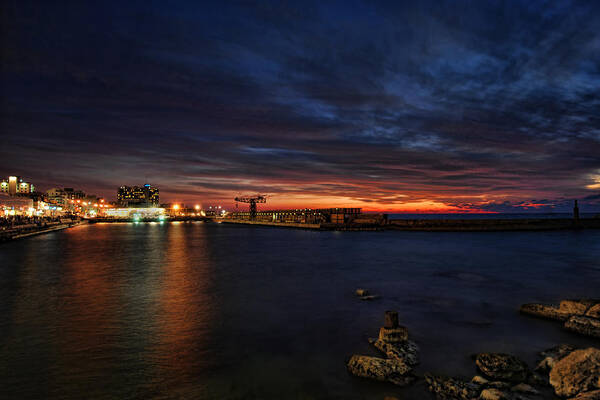 Israel Art Print featuring the photograph a flaming sunset at Tel Aviv port by Ron Shoshani