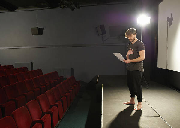 Focus Art Print featuring the photograph Actor rehearsing his lines on stage. by Dougal Waters