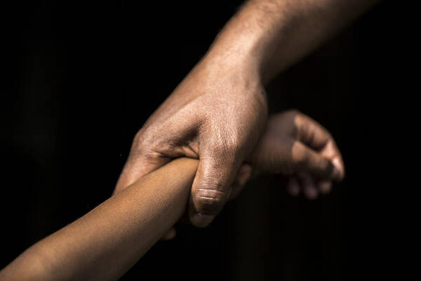 Child Art Print featuring the photograph Adult holding a child's wrist by James Morgan