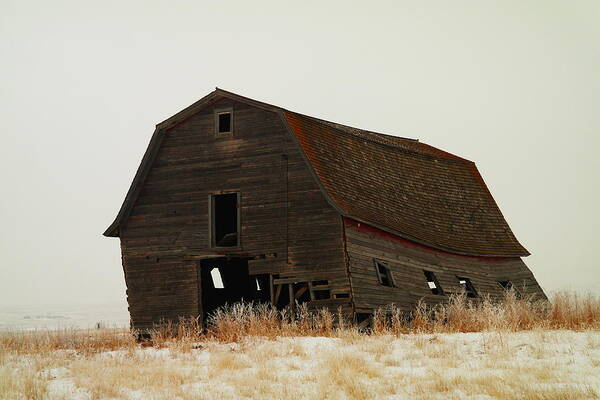 Barns Art Print featuring the photograph An Old Leaning Barn In North Dakota by Jeff Swan