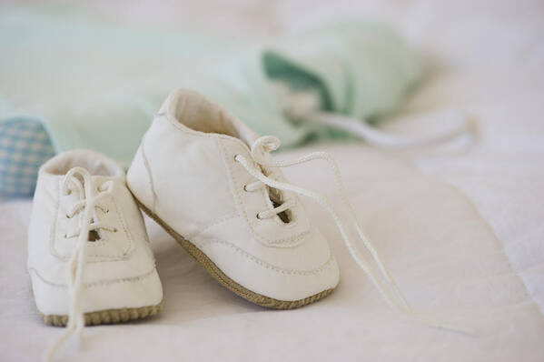 White Background Art Print featuring the photograph Baby shoes by Daniel Grill