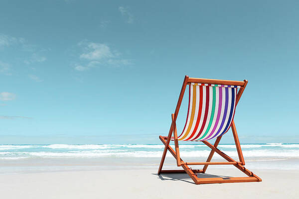 Tranquility Art Print featuring the photograph Beach Chair With Rainbow Stripes by John White Photos