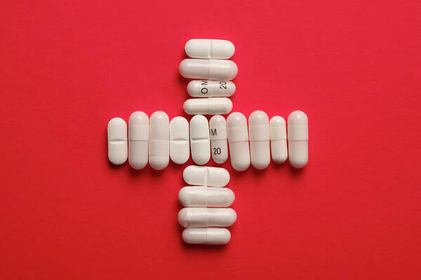 Expertise Art Print featuring the photograph Capsules And Tablets Arranged In A by Larry Washburn