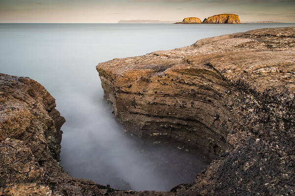 Sheep Island Art Print featuring the photograph Carved by the Sea - Ballintoy by Nigel R Bell