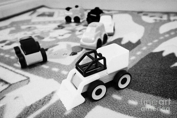 Childrens Art Print featuring the photograph Childs Toy Cars And Construction Set On A Road Playmat by Joe Fox