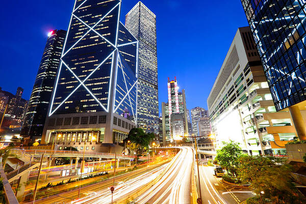 Financial Building Art Print featuring the photograph City At Night With Traffic Trails by Ngkaki