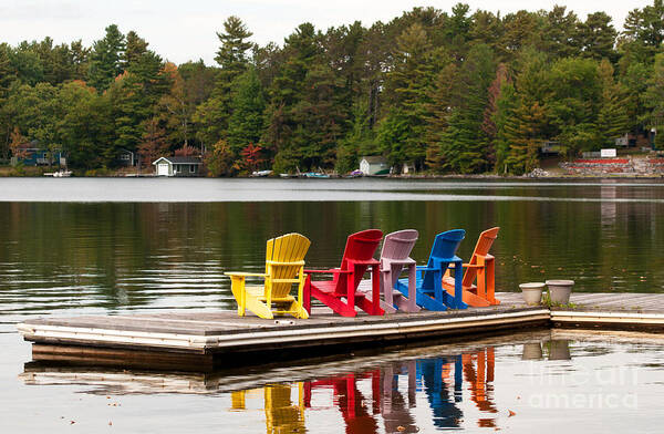 Five Art Print featuring the photograph Colorful chairs at the lake by Les Palenik