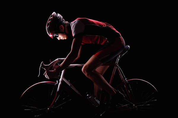 People Art Print featuring the photograph Cyclist On Black Background by Stanislaw Pytel