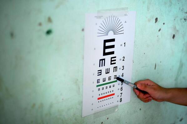 People Art Print featuring the photograph Eye Test During Humanitarian Exercise by Sara Csurilla