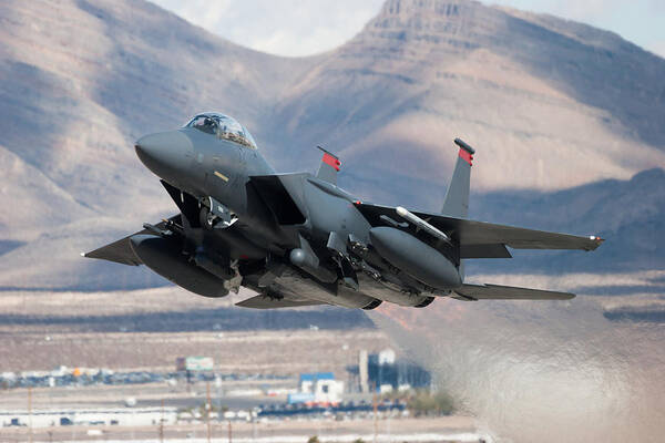 Taking Off Art Print featuring the photograph F-15E Strike Eagle flying past mountains by CT757fan